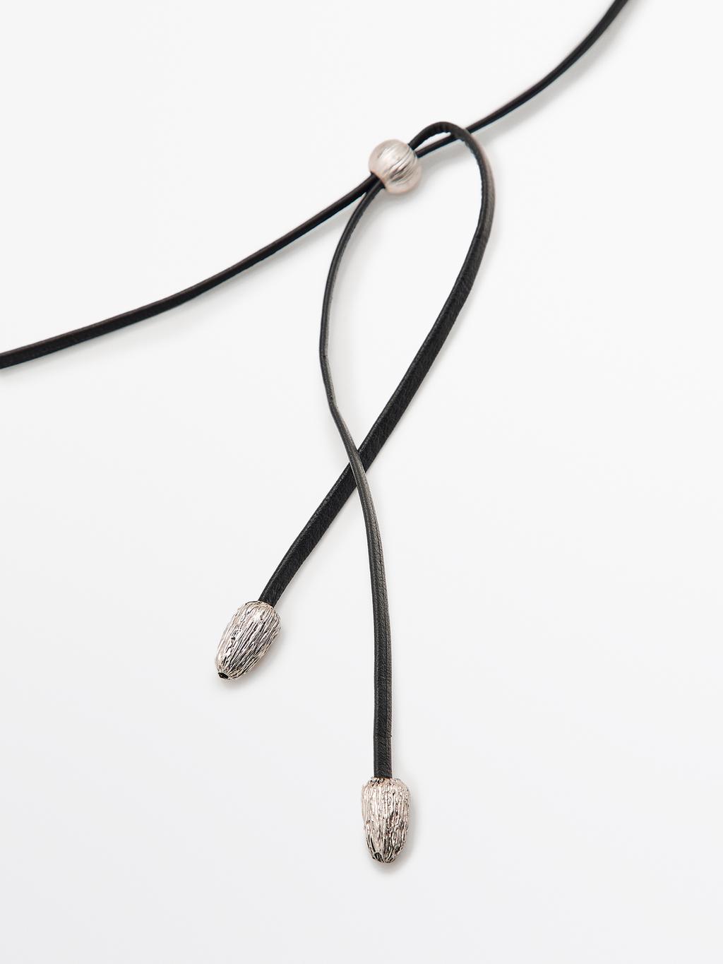 Necklace with fossil piece pendant