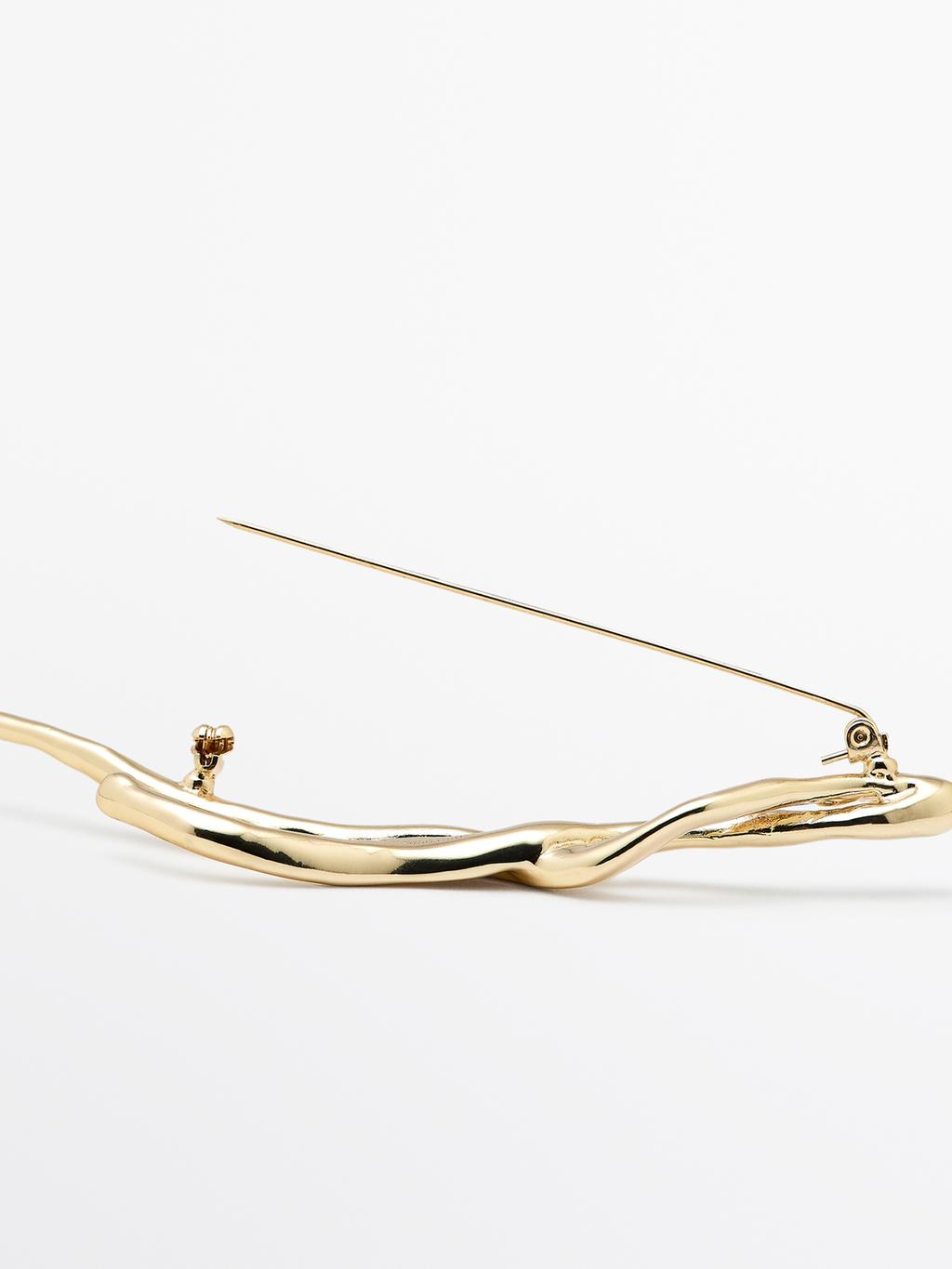 Abstract metal brooch