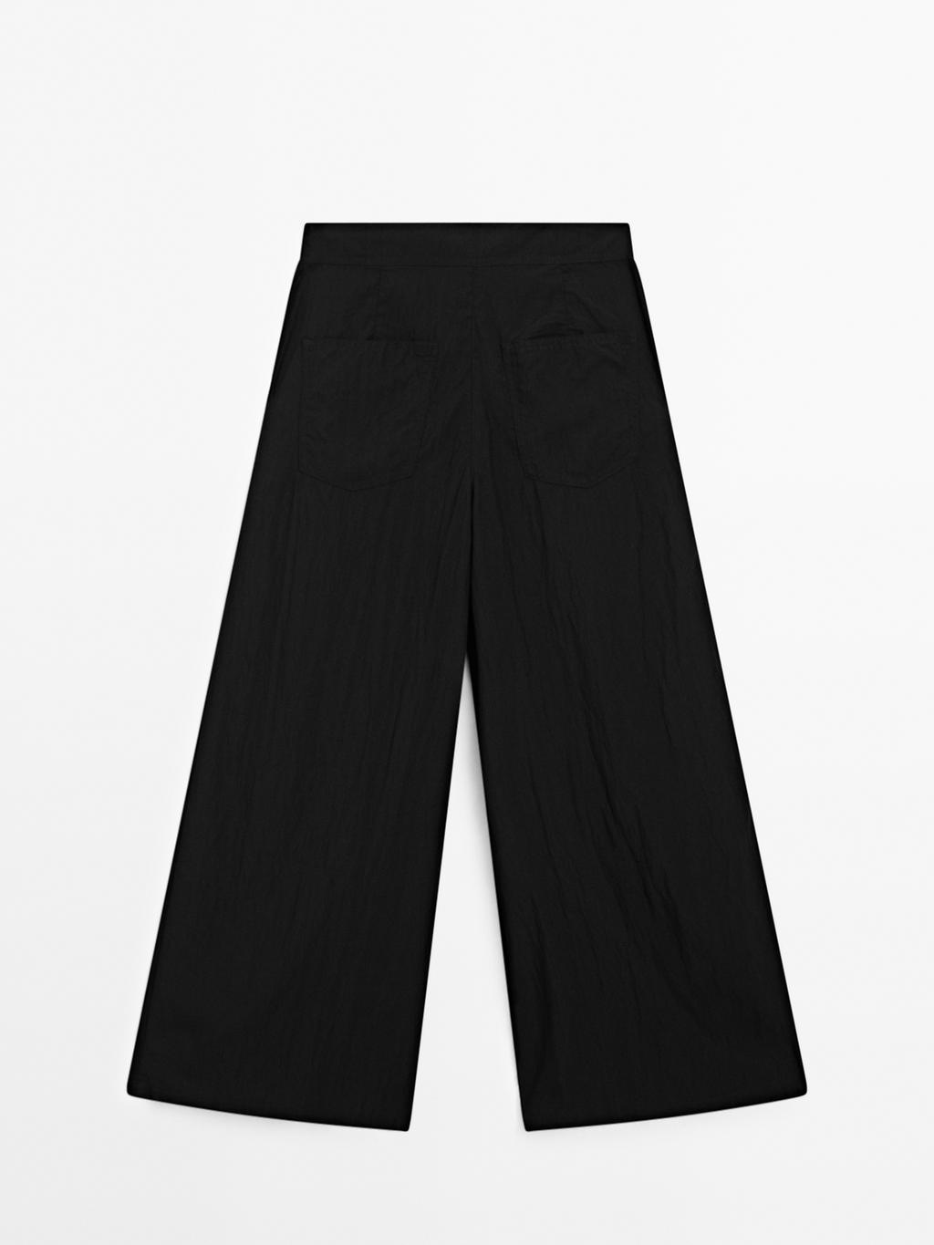 Flowing palazzo trousers with darts