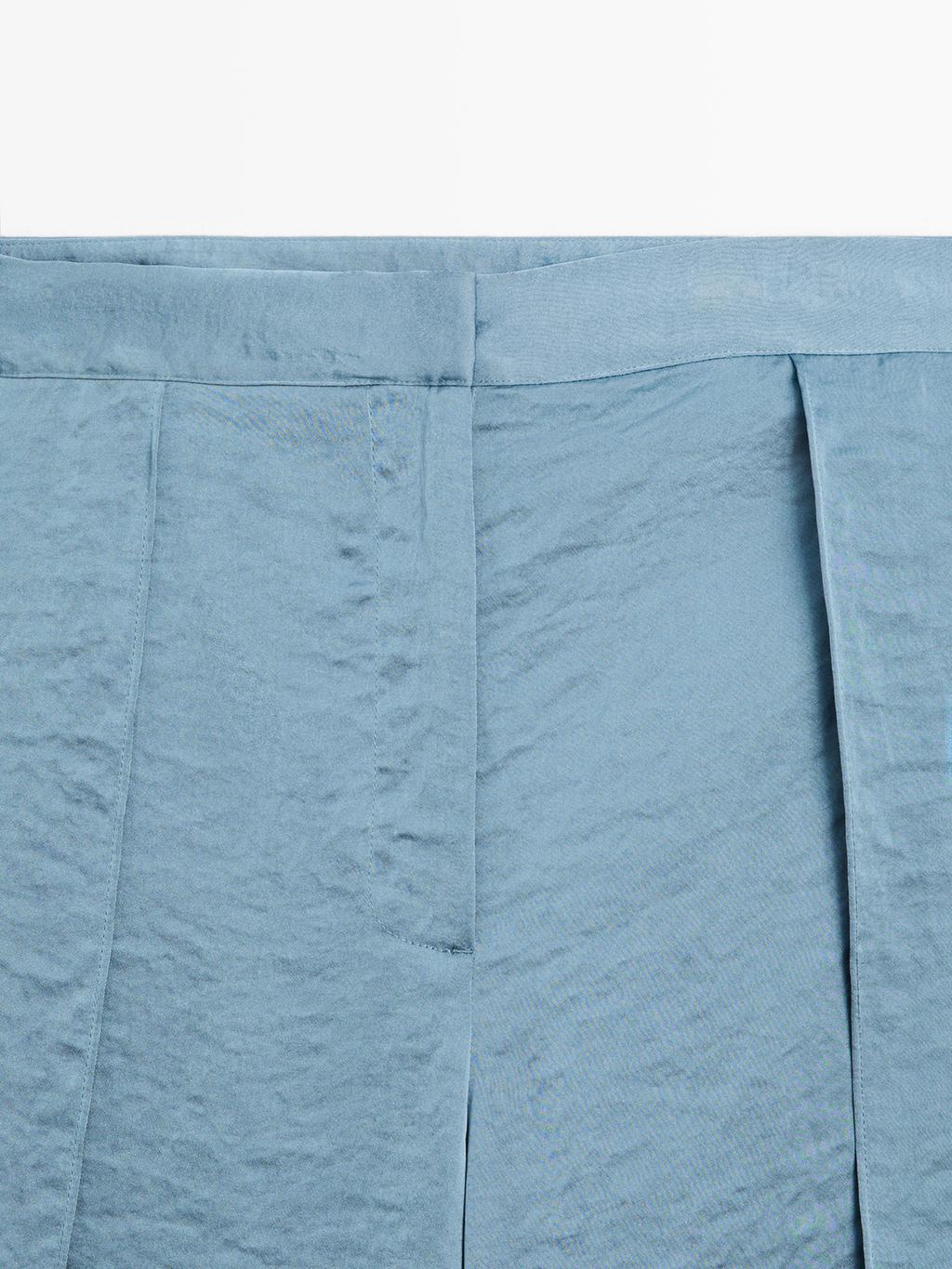 Flowing palazzo trousers with slits