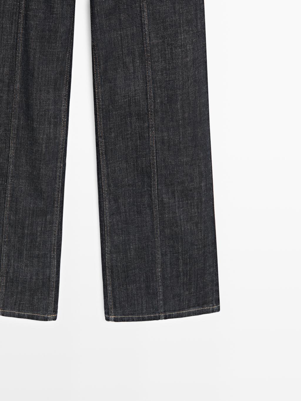 High-waist wide-leg jeans with chains