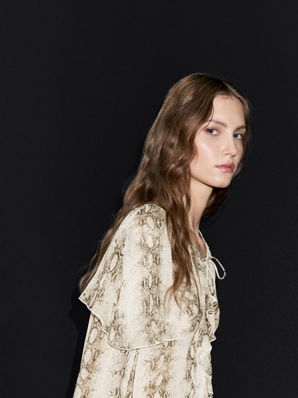 Snakeskin print blouse with ruffles