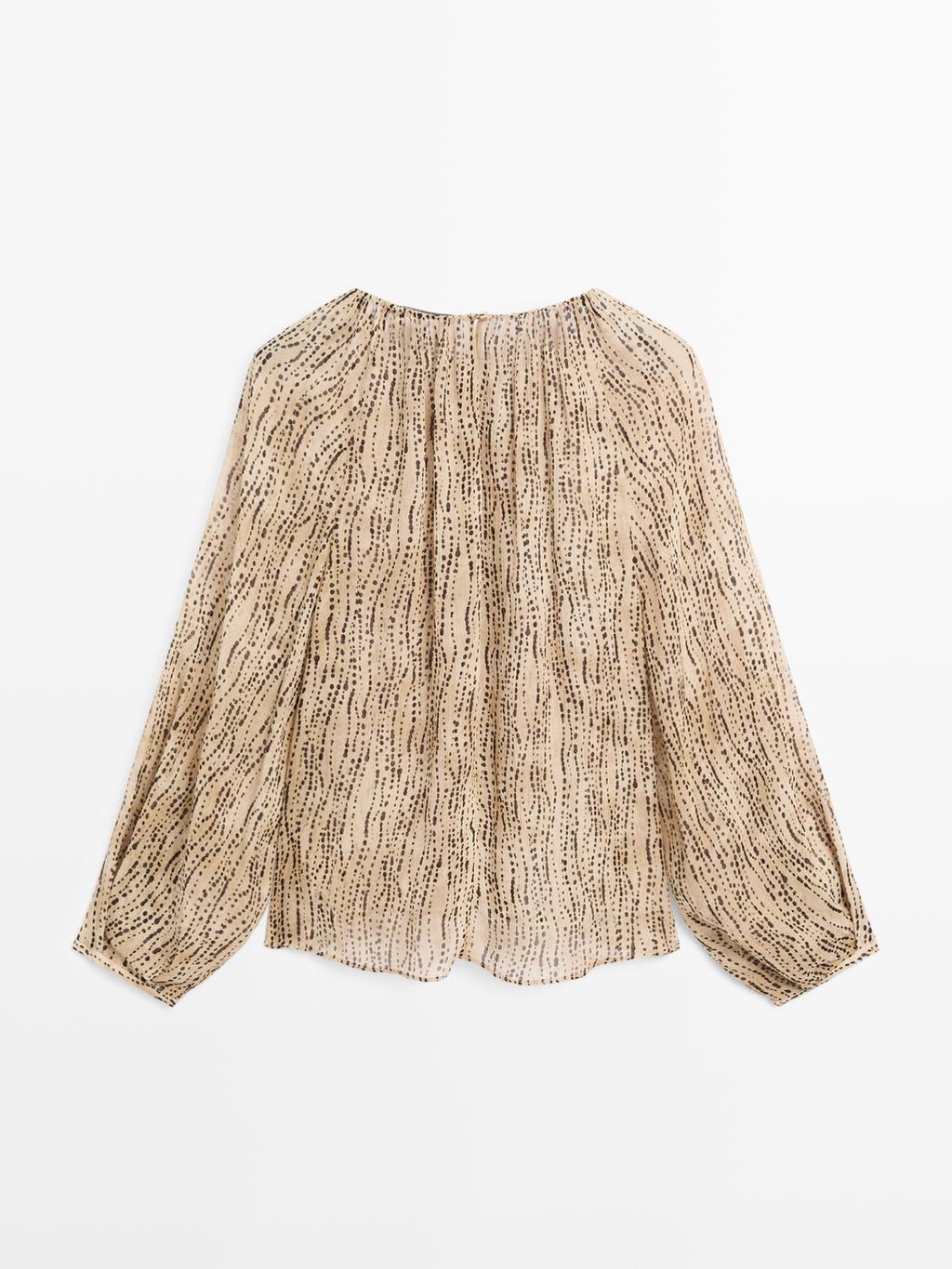 Semi-sheer draped blouse