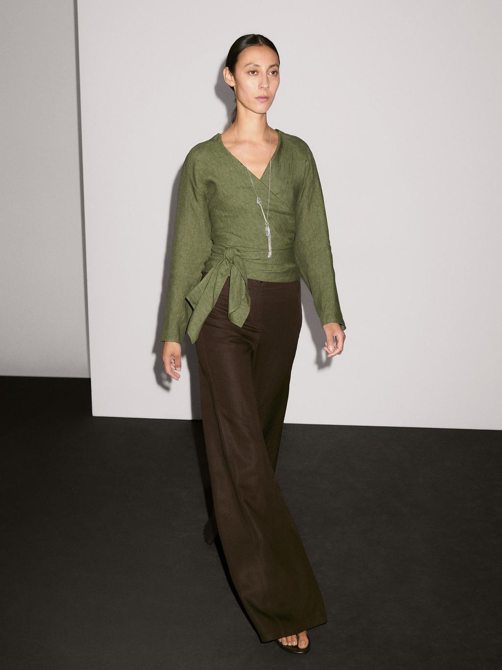 Flowing linen blouse with tie detail at the waist