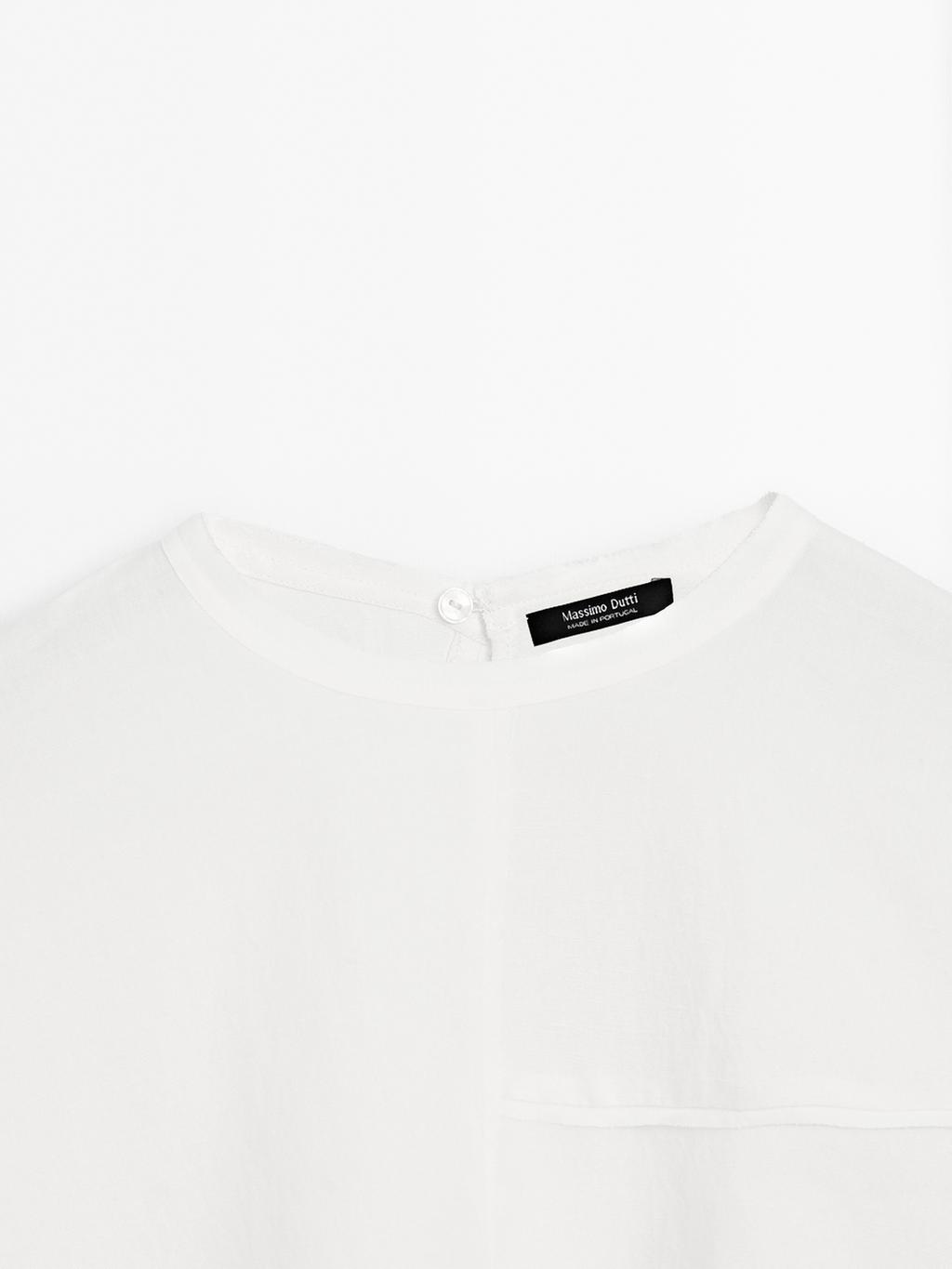 Short cape with seam details