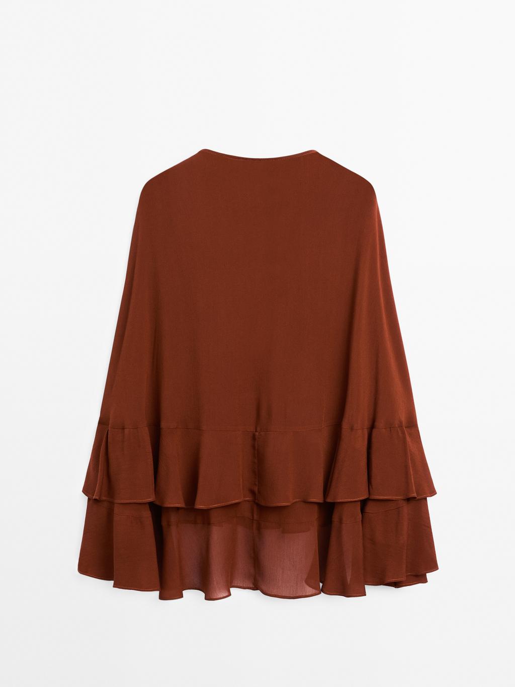 Cape-style blouse with ruffles