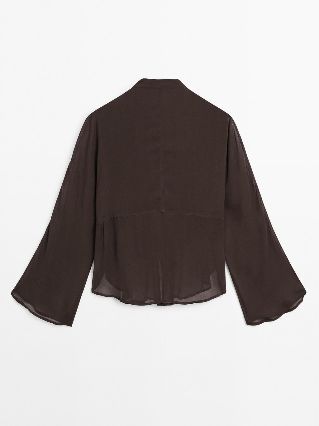 Flowing bib-front shirt with ruffles