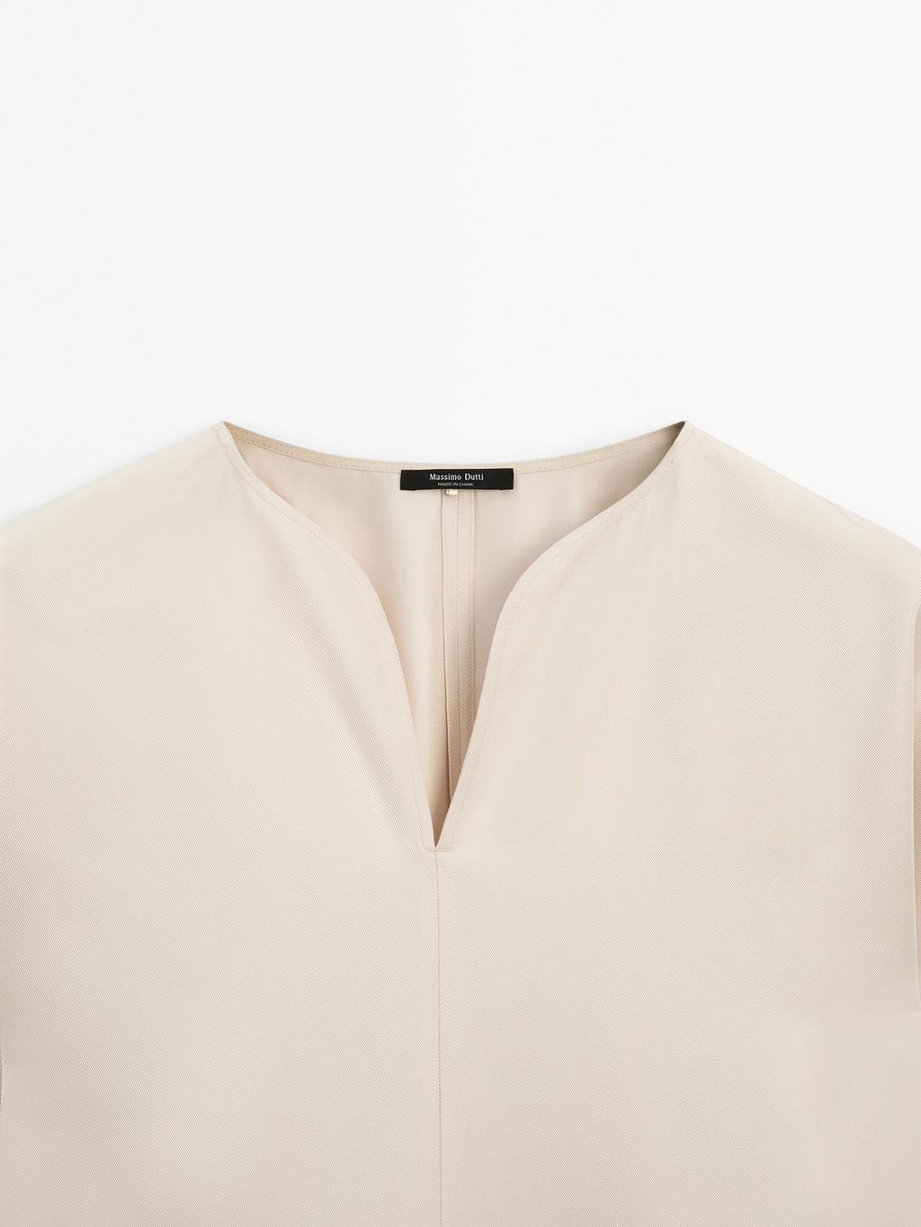 Flowing blouse with slit details