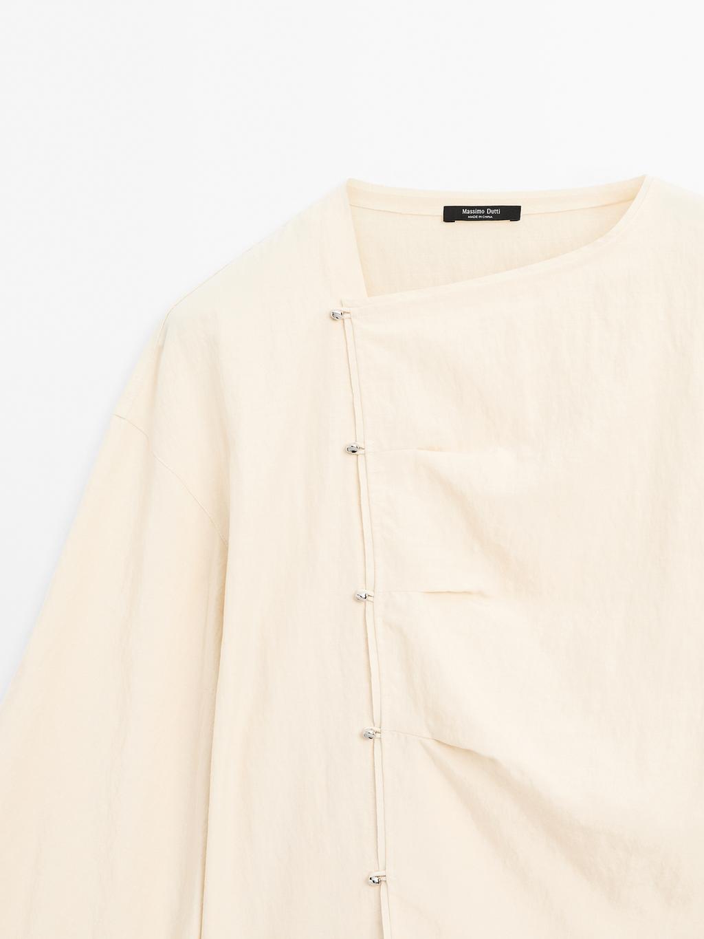 Long sleeve blouse with side button fastening