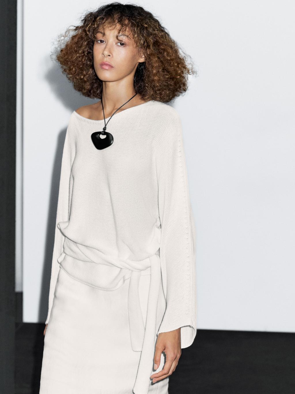 Knit sweater with bow detail