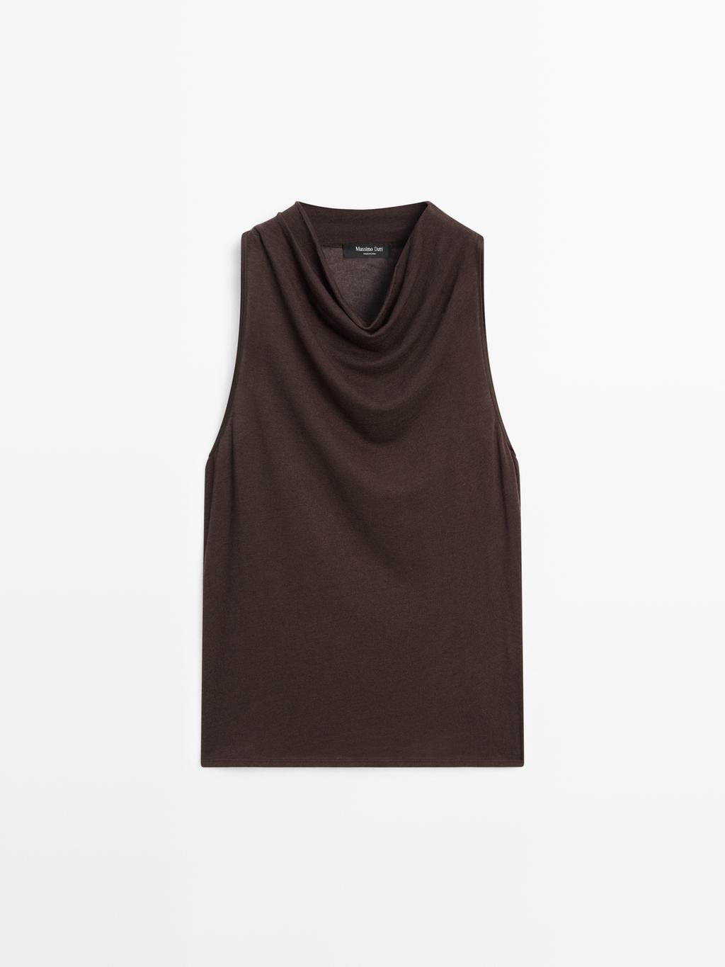 Sleeveless top with draped neckline