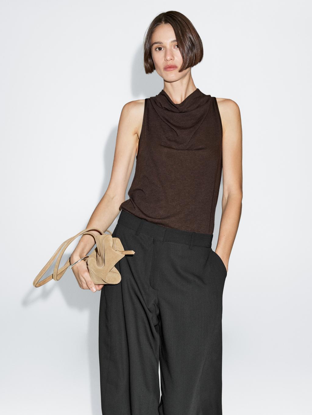 Sleeveless top with draped neckline