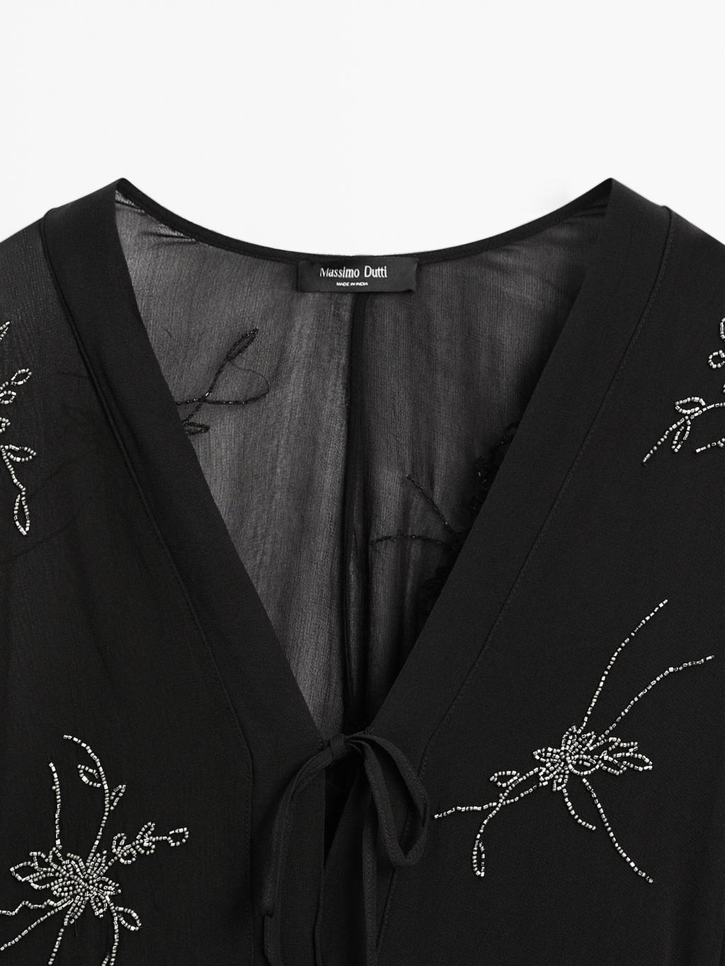 Flowing midi dress with embroidery