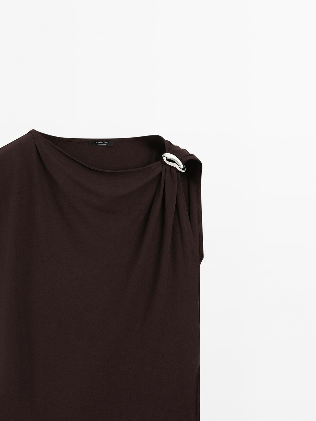 Draped neckline top with brooch detail