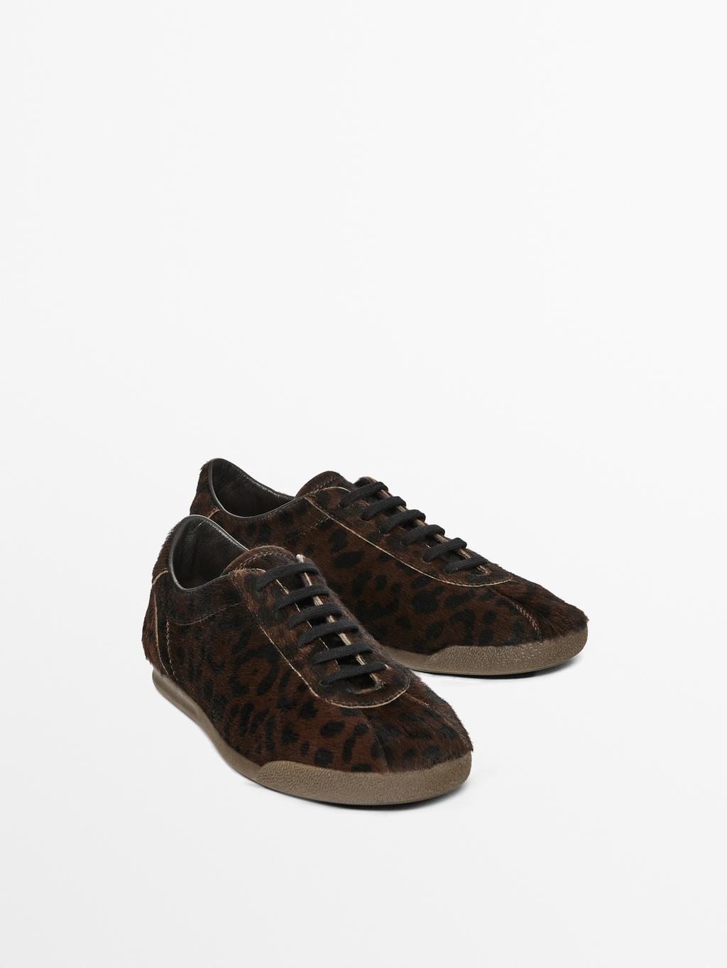 Leopard print hair on leather trainers