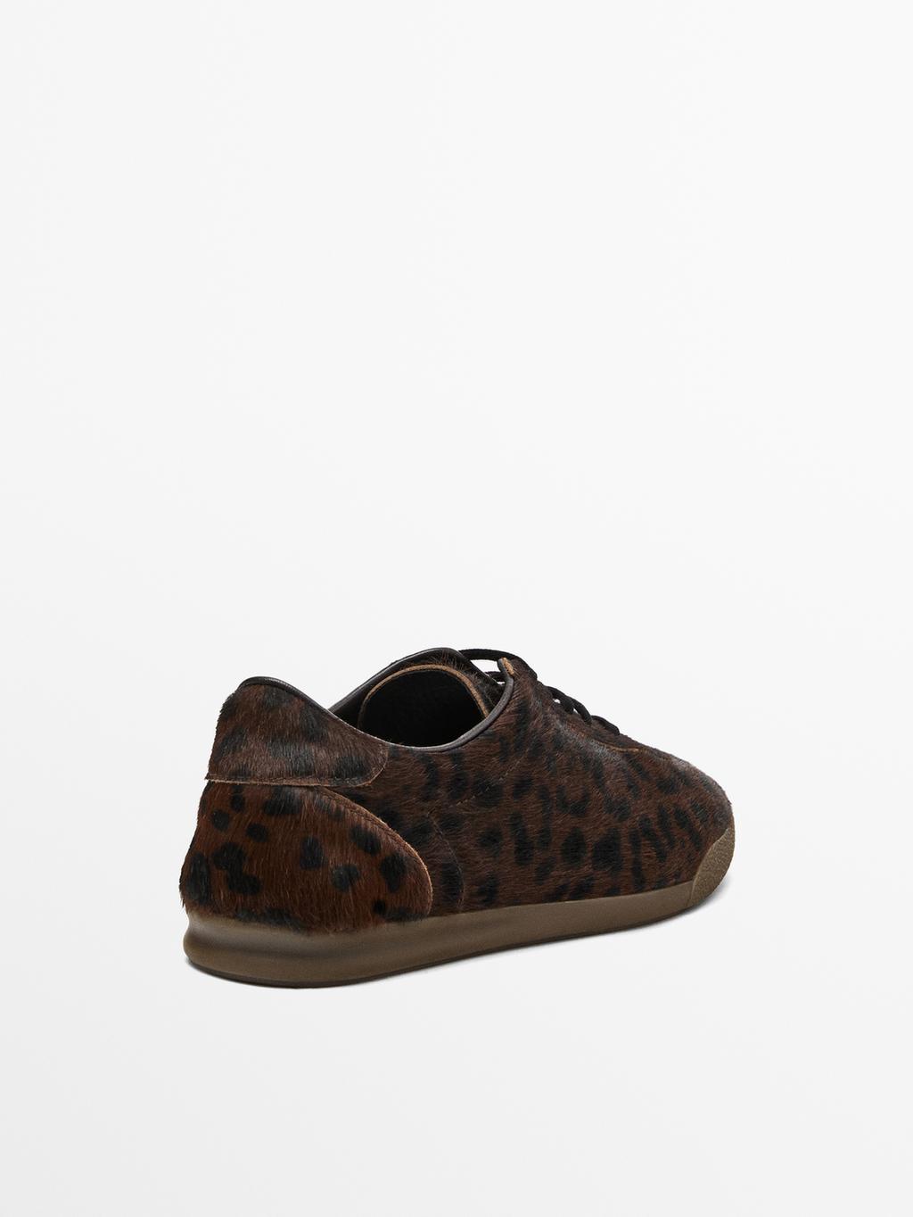 Leopard print hair on leather trainers