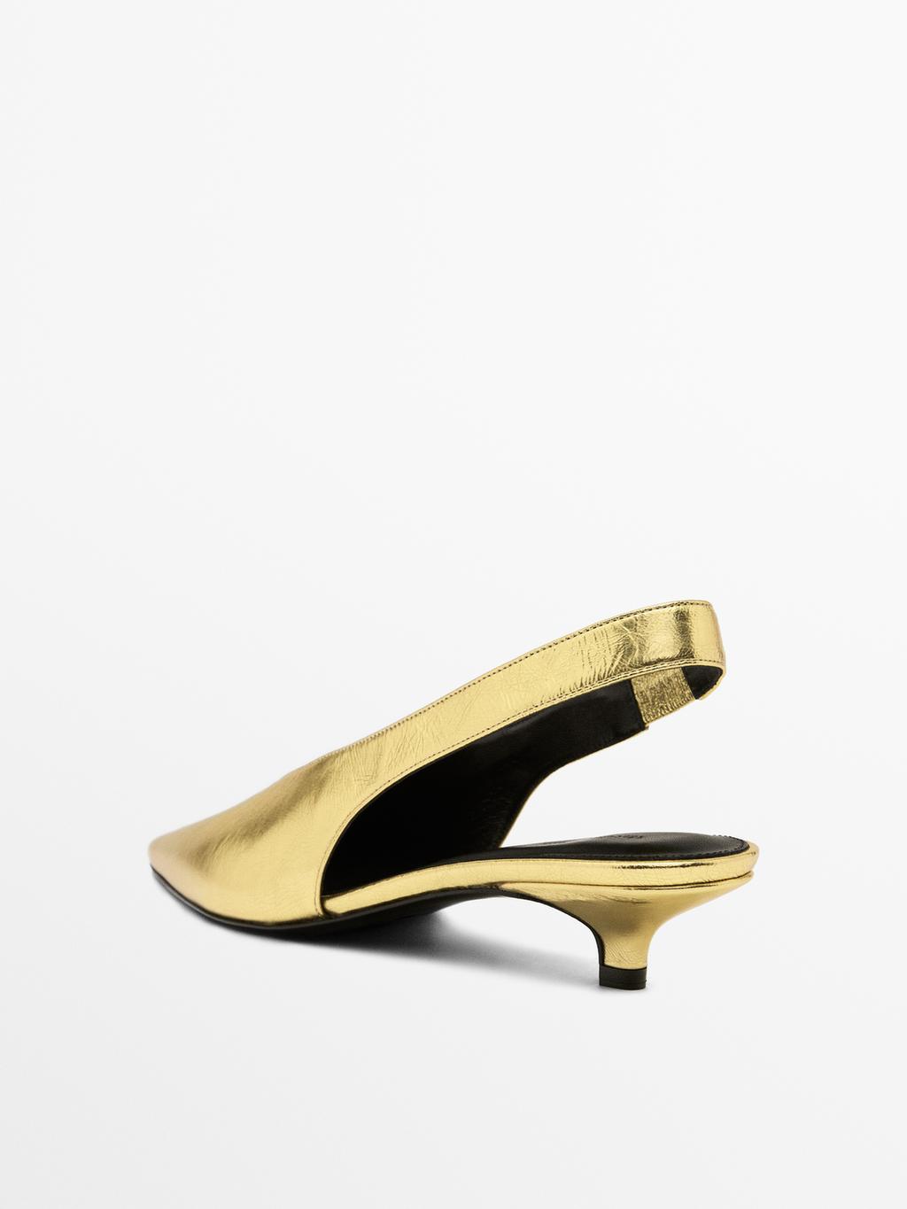 Gold high-heel slingback shoes