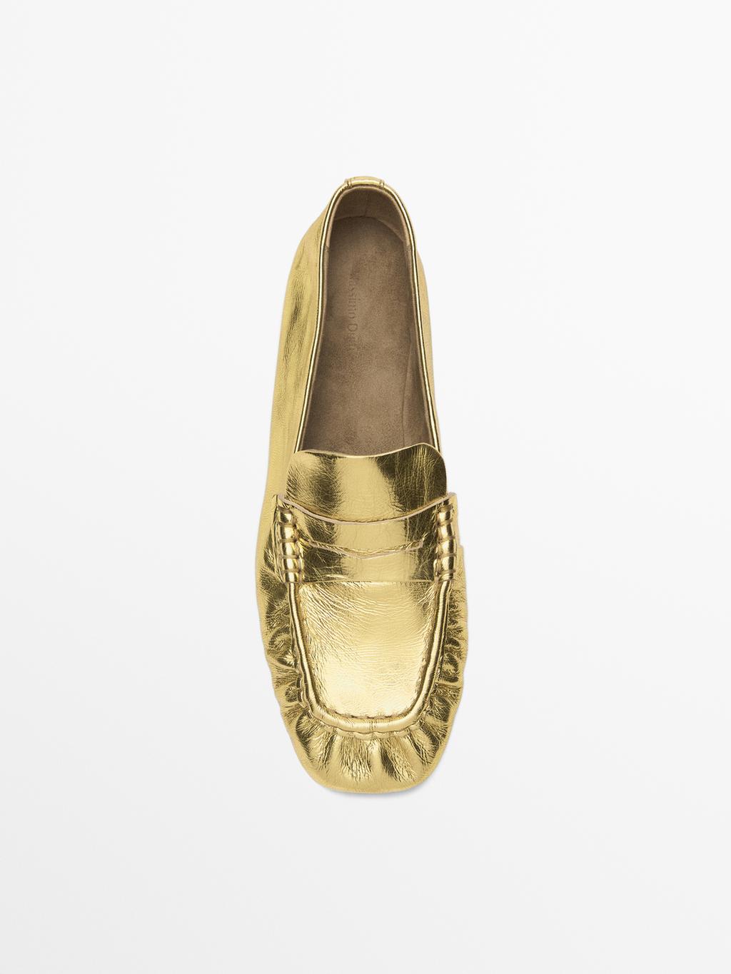 Gold penny loafers