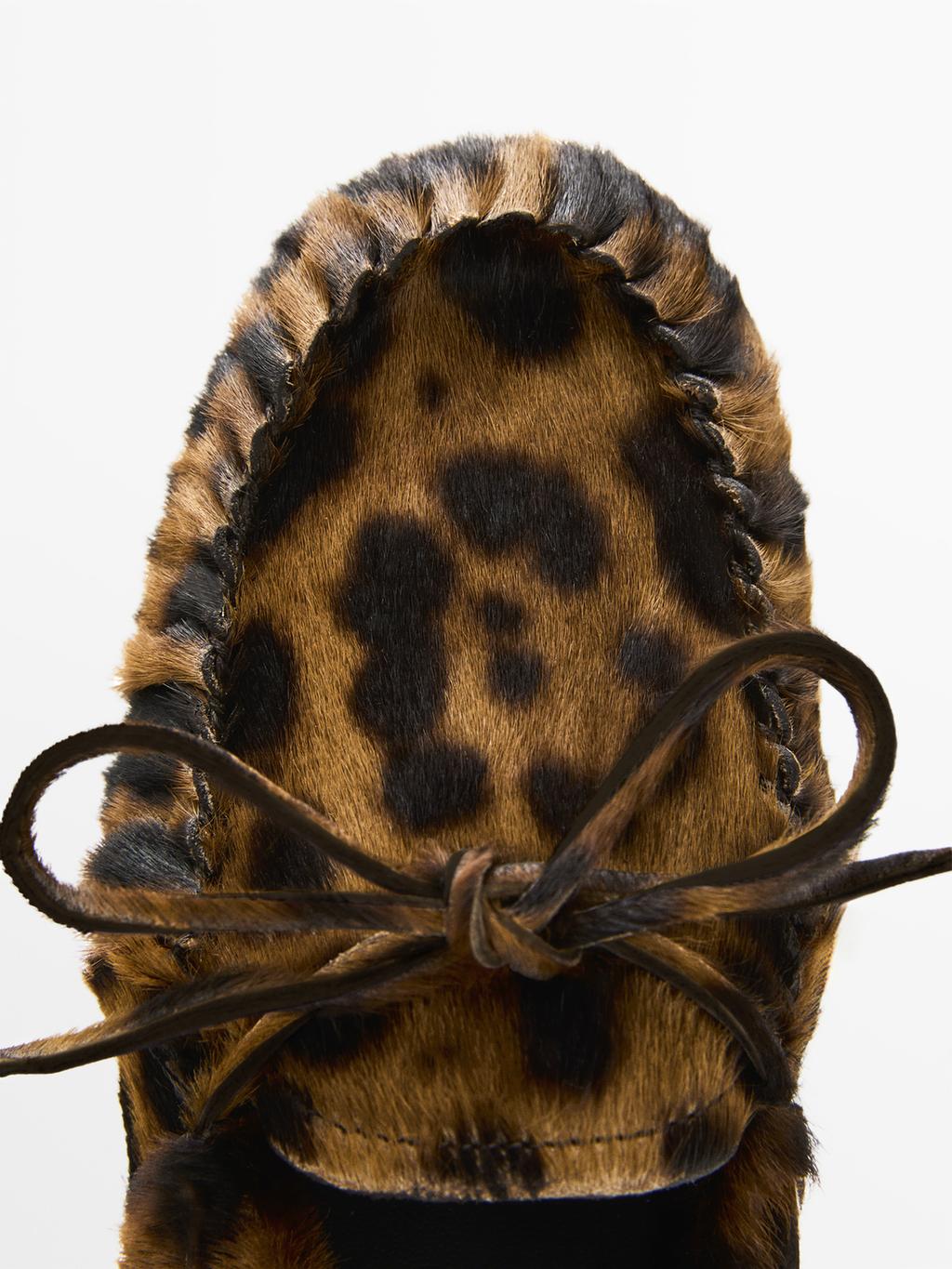 Leopard print deck shoes
